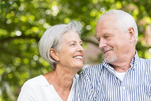 older couple smiling at each other 