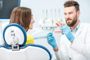 woman talking to dentist