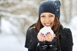 Woman smiling in snow.