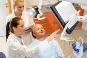 dentist talking to a patient about treatment options