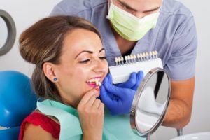 Woman improving her smile with veneers.